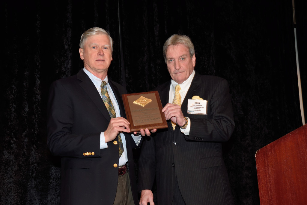 Oceaneering, Inc. CEO Kevin McEvoy (left) receives the 2016 Safety in Seas Safety Practice Award from Amos Busmann, President of Compass Publications (right).